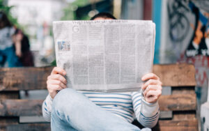 person reading newspaper